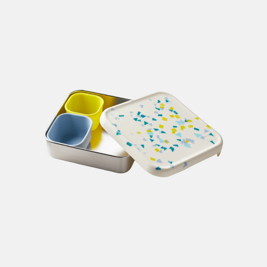 color::White Sand Terrazzo | Open view of white sand Trailblazer, showing included snack pods in purple and yellow colors.